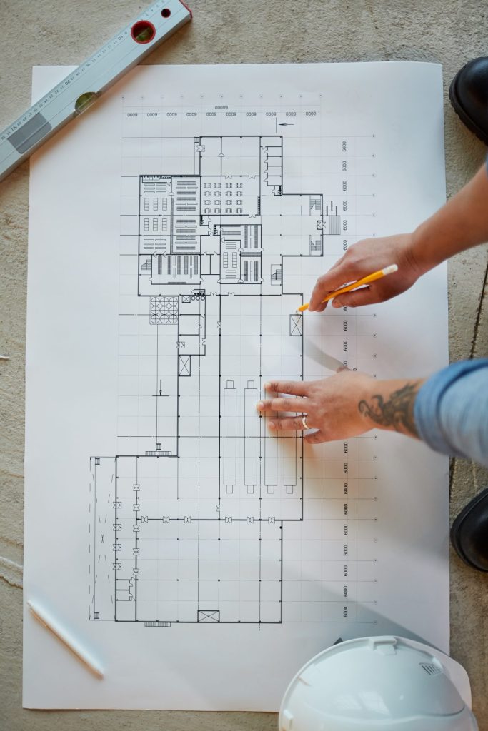 Engineer reviewing commercial building architectural plans