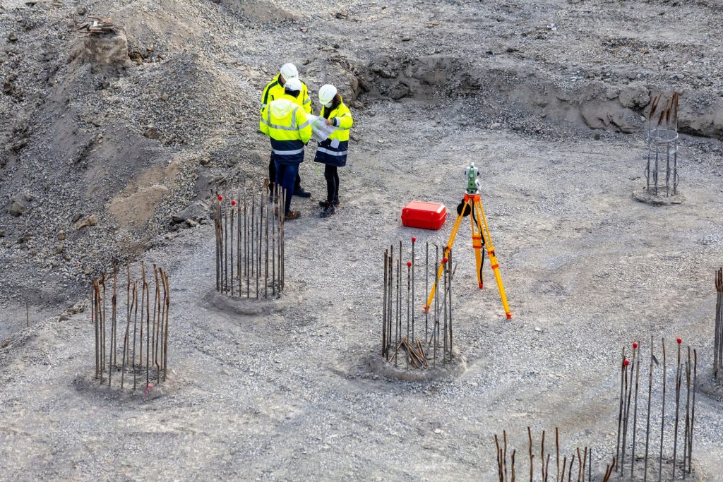 Engineers reviewing site plans for commercial energy infrastructure project