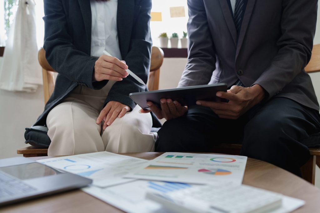 Business professionals analysing energy efficiency data for commercial energy solutions